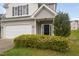 Close up of a beautiful home with a two car garage and a manicured lawn at 4038 Patriot Ridge Ct, Raleigh, NC 27610
