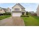 Charming two-story home with a two car garage and well-maintained landscaping at 4038 Patriot Ridge Ct, Raleigh, NC 27610