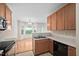 Bright eat-in kitchen features wooden cabinets, breakfast area, and natural light at 4038 Patriot Ridge Ct, Raleigh, NC 27610