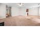 Spacious living room featuring a ceiling fan and neutral tones offering versatility for decor styles at 4038 Patriot Ridge Ct, Raleigh, NC 27610