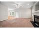 Bright living room featuring a fireplace, sliding glass doors, and ample natural light at 4038 Patriot Ridge Ct, Raleigh, NC 27610
