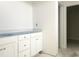Bathroom with white cabinets, countertop with blue protective film at 47 Tee Time Ter, Benson, NC 27504