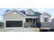 Charming, single-Gathering home with a two-car garage, craftsman details, and stone accents in a construction zone at 47 Tee Time Ter, Benson, NC 27504