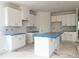 Large kitchen with white cabinetry and a central island, prepped for countertops at 47 Tee Time Ter, Benson, NC 27504