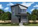 Charming two-story home with modern architectural design and a welcoming front porch at 50 Rainfall Dr, Pittsboro, NC 27312