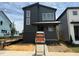 Modern two-story home with dark siding, white trim, and a brick foundation at 50 Rainfall Dr, Pittsboro, NC 27312