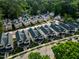 An aerial view of a neatly planned neighborhood surrounded by lush greenery and tree coverage at 5057 Lundy Dr # 101, Raleigh, NC 27606