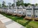 Neat backyards with black iron fences in a well maintained community of two-story homes at 5057 Lundy Dr # 101, Raleigh, NC 27606