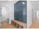 Hallway featuring hardwood floors and a shiplap accent wall at 5057 Lundy Dr # 101, Raleigh, NC 27606