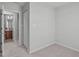 Bedroom with neutral walls and carpet and doorway to an en-suite bathroom at 5210 Blue Lagoon Ln, Raleigh, NC 27610