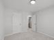 Neutral bedroom with carpet and two doorways, one leading to en-suite bathroom at 5210 Blue Lagoon Ln, Raleigh, NC 27610