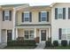 Charming two-story home with stone accents, gray shutters and landscaped yard at 5210 Blue Lagoon Ln, Raleigh, NC 27610