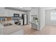 Modern kitchen features white cabinets, stainless steel appliances, and stylish backsplash at 5210 Blue Lagoon Ln, Raleigh, NC 27610