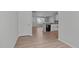 Bright eat-in kitchen features modern appliances, white cabinetry and wood-look floors at 5210 Blue Lagoon Ln, Raleigh, NC 27610