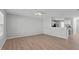 Open living room area with clear view to kitchen area, with hard surface flooring at 5210 Blue Lagoon Ln, Raleigh, NC 27610