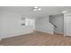 Open-concept living area showcases modern flooring, a staircase, and abundant natural light at 5210 Blue Lagoon Ln, Raleigh, NC 27610