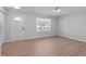 Bright front room with new laminate flooring, door and windows at 5210 Blue Lagoon Ln, Raleigh, NC 27610