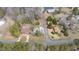An aerial shot shows the property amidst trees, streets, and nearby buildings in a neighborhood at 603 W Main St, Haw River, NC 27258