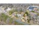 An aerial shot shows the location of the house near the trees and road in the neighborhood at 603 W Main St, Haw River, NC 27258