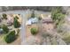 An overhead aerial view showcases the house and landscaping in the surrounding neighborhood at 603 W Main St, Haw River, NC 27258