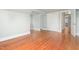 Neutral bedroom features hardwood floors, closet, and two windows at 603 W Main St, Haw River, NC 27258