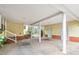 Spacious carport features concrete flooring and supports at 603 W Main St, Haw River, NC 27258