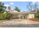 Quaint house with carport and yellow siding at 603 W Main St, Haw River, NC 27258