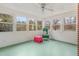 Cozy sunroom with many windows and neutral paint at 603 W Main St, Haw River, NC 27258
