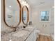 Bright bathroom featuring a double vanity, granite countertop, and a spacious tile shower at 605 Canterbury Rd, Sanford, NC 27330