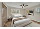 Bedroom features neutral walls, wood-look floors, and a window with natural light at 605 Canterbury Rd, Sanford, NC 27330