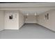 Spacious garage with ample lighting, fresh paint, two windows and painted floors at 605 Canterbury Rd, Sanford, NC 27330