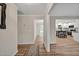 Bright hallway with wood flooring, and updated trim, with views of other rooms at 605 Canterbury Rd, Sanford, NC 27330