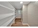 Storage room with wood flooring, shelves, and a small window for natural light at 605 Canterbury Rd, Sanford, NC 27330