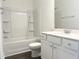 Clean bathroom featuring a white vanity, toilet, and tub-shower combination at 63 Tee Time Ter, Benson, NC 27504