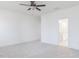Bright bedroom with carpet flooring, neutral walls, a ceiling fan, and a bathroom entrance at 63 Tee Time Ter, Benson, NC 27504