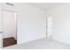 Bright bedroom with carpet, white walls, and access to an ensuite bathroom and walk in closet at 63 Tee Time Ter, Benson, NC 27504
