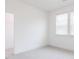 Bedroom with carpet, white walls, and closet; sunlit by large windows at 63 Tee Time Ter, Benson, NC 27504