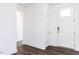 View of entryway with wood flooring, front door, and coat closet at 63 Tee Time Ter, Benson, NC 27504