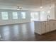 Open-concept living area features hardwood floors, recessed lighting, and ceiling fan at 63 Tee Time Ter, Benson, NC 27504