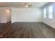 Spacious living room with hardwood floors, neutral walls, and plenty of natural light from large windows at 63 Tee Time Ter, Benson, NC 27504