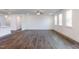 Spacious living room with hardwood floors and large windows allowing plenty of natural light at 63 Tee Time Ter, Benson, NC 27504