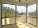 Enjoy peaceful outdoor living on this screened-in patio with views of the natural landscape at 63 Tee Time Ter, Benson, NC 27504