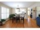 Dining area with hardwood floors and a view of the kitchen at 703 E Stanley St, Four Oaks, NC 27524