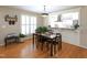 Dining area with plantation shutters and hardwood floors at 703 E Stanley St, Four Oaks, NC 27524