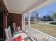 Relaxing front porch with comfortable seating, perfect for enjoying the pleasant neighborhood scenery at 703 E Stanley St, Four Oaks, NC 27524
