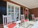 Cozy front porch with rocking chairs, offering a perfect spot for relaxation and neighborhood views at 703 E Stanley St, Four Oaks, NC 27524