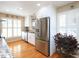 Well-lit kitchen with stainless steel appliances and white cabinetry at 703 E Stanley St, Four Oaks, NC 27524