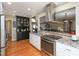 Kitchen with stainless steel appliances and granite countertops at 703 E Stanley St, Four Oaks, NC 27524