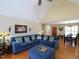 Living room with hardwood floors and a comfortable blue sofa at 703 E Stanley St, Four Oaks, NC 27524