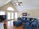 Bright living room with vaulted ceilings and hardwood floors at 703 E Stanley St, Four Oaks, NC 27524